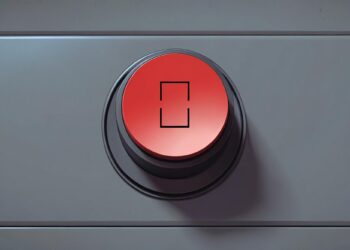 Gri panel üzerinde ortasında kare sembol bulunan kırmızı acil durum butonu.