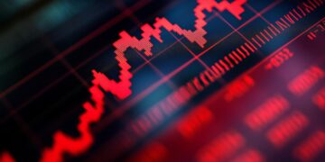 Kırmızı renkli dijital borsa grafik ekranı ve düşüş trendi.