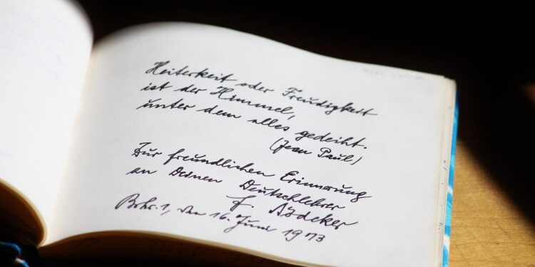 Açık bir defter sayfasında Almanca el yazısı ve imza yer alıyor.